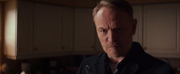 Movie still from “Poltergeist” (2015), directed by Gil Kenan – A person wearing a black shirt; Close Up shot, Low angle