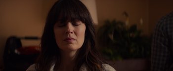 Movie still from “Poltergeist” (2015), directed by Gil Kenan – A person with her eyes closed; Close Up shot, Low angle