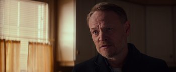 Movie still from “Poltergeist” (2015), directed by Gil Kenan – A person wearing a black shirt; Close Up shot, Over the shoulder angle
