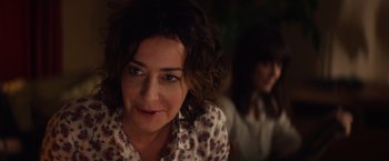 Movie still from “Poltergeist” (2015), directed by Gil Kenan – A person sitting down looking at the camera; Close Up shot, Over the shoulder angle