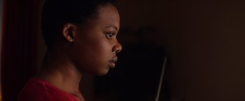 Movie still from “Poltergeist” (2015), directed by Gil Kenan – A person looking at a computer screen; Close Up shot, Low angle