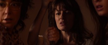 Movie still from “Poltergeist” (2015), directed by Gil Kenan – A person brushing her brown hair; Close Up shot, Over the shoulder angle