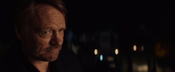 Movie still from “Poltergeist” (2015), directed by Gil Kenan – A person with a car in the background; Close Up shot, Over the shoulder angle