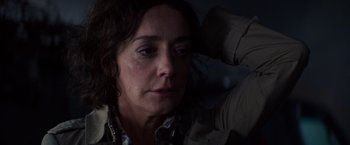 Movie still from “Poltergeist” (2015), directed by Gil Kenan – A person sitting down with her head down; Close Up shot, Over the shoulder angle