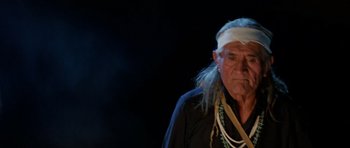 Movie still from “Poltergeist II: The Other Side” (1986), directed by Brian Gibson – An old man with a long white beard and a white headband; Close Up shot, Low angle