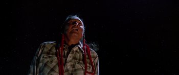 Movie still from “Poltergeist II: The Other Side” (1986), directed by Brian Gibson – A man in a plaid shirt and red braids; Medium shot, Low angle