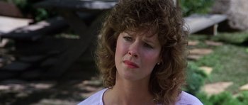 Movie still from “Poltergeist II: The Other Side” (1986), directed by Brian Gibson – A person with curly brown hair; Close Up shot, Low angle