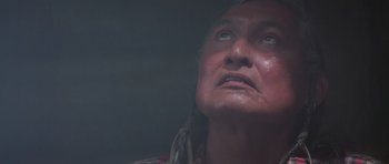 Movie still from “Poltergeist II: The Other Side” (1986), directed by Brian Gibson – An old woman with a long hair and a red shirt; Close Up shot, Low angle