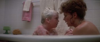 Movie still from “Poltergeist II: The Other Side” (1986), directed by Brian Gibson – A woman and a child in a bath tub in a bathroom; Close Up shot, Low angle