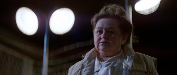 Movie still from “Poltergeist II: The Other Side” (1986), directed by Brian Gibson – An older woman is looking into the distance; Close Up shot, Low angle