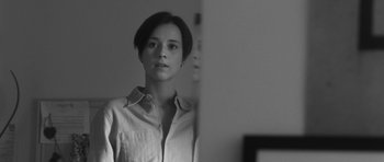 Movie still from “Polytechnique” (2009), directed by Denis Villeneuve – Black and white photograph of a woman looking at a mirror; Close Up shot, Low angle