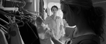Movie still from “Polytechnique” (2009), directed by Denis Villeneuve – Two women are looking at each other in a closet; Medium shot, Over the shoulder angle