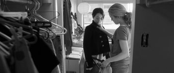 Movie still from “Polytechnique” (2009), directed by Denis Villeneuve – Two women in a room with some clothes on; Medium shot, Over the shoulder angle