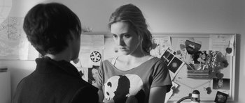 Movie still from “Polytechnique” (2009), directed by Denis Villeneuve – A woman in a t - shirt is looking at another woman; Close Up shot, Over the shoulder angle