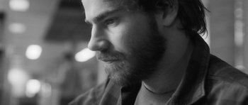 Movie still from “Polytechnique” (2009), directed by Denis Villeneuve – Black and white photograph of a man with a beard; Close Up shot, Low angle