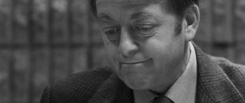 Movie still from “Polytechnique” (2009), directed by Denis Villeneuve – Black and white photograph of a man in a suit; Close Up shot, Over the shoulder angle