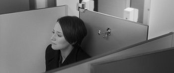 Movie still from “Polytechnique” (2009), directed by Denis Villeneuve – A black and white photo of a woman looking at herself in the mirror; Medium shot, Over the shoulder angle