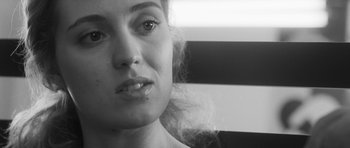 Movie still from “Polytechnique” (2009), directed by Denis Villeneuve – A woman's face in black and white; Close Up shot, Over the shoulder angle