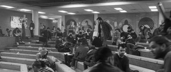 Movie still from “Polytechnique” (2009), directed by Denis Villeneuve – A group of people sitting in a room; Wide shot, High angle