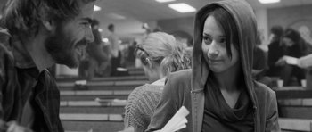 Movie still from “Polytechnique” (2009), directed by Denis Villeneuve – A woman sitting on a bench in a room; Close Up shot, Over the shoulder angle