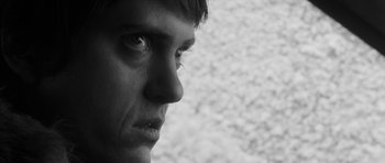 Movie still from “Polytechnique” (2009), directed by Denis Villeneuve – A man's face in black - and - white; Extreme Close Up shot, Low angle