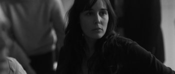 Movie still from “Polytechnique” (2009), directed by Denis Villeneuve – A black - and - white photo of a woman looking at the camera; Close Up shot, Over the shoulder angle