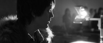 Movie still from “Polytechnique” (2009), directed by Denis Villeneuve – A woman with a feather in her mouth; Close Up shot, Over the shoulder angle