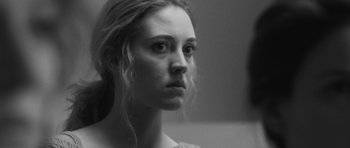 Movie still from “Polytechnique” (2009), directed by Denis Villeneuve – Black and white photograph of a woman looking at the camera; Close Up shot, Over the shoulder angle
