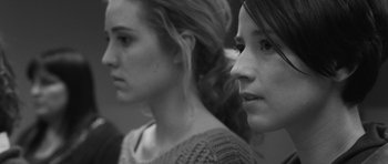 Movie still from “Polytechnique” (2009), directed by Denis Villeneuve – Two young women standing next to each other; Close Up shot, Low angle