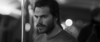 Movie still from “Polytechnique” (2009), directed by Denis Villeneuve – Black and white photograph of a man with a beard; Close Up shot, Low angle