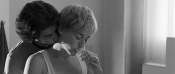 Movie still from “Polytechnique” (2009), directed by Denis Villeneuve – A woman with short blonde hair is brushing her teeth; Close Up shot, Over the shoulder angle