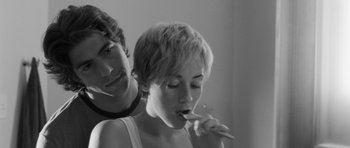 Movie still from “Polytechnique” (2009), directed by Denis Villeneuve – A young woman brushing her teeth while a young man looks on; Close Up shot, Over the shoulder angle