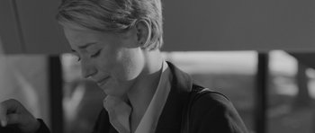 Movie still from “Polytechnique” (2009), directed by Denis Villeneuve – A woman with short blonde hair is looking down at her face; Close Up shot, Over the shoulder angle
