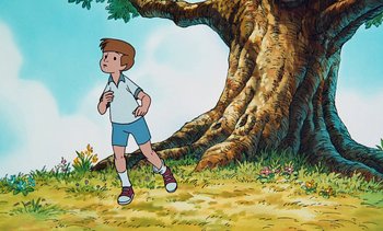 Movie still from “Pooh's Grand Adventure: The Search for Christopher Robin” (1997), directed by Karl Geurs – A cartoon of a boy running in front of a large tree; Wide shot, Low angle