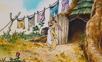 Movie still from “Pooh's Grand Adventure: The Search for Christopher Robin” (1997), directed by Karl Geurs – A painting of a rabbit standing in front of a clothesline; Wide shot, Low angle