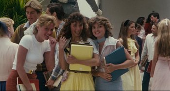 Movie still from “Porky's” (1981), directed by Bob Clark – A group of women standing next to each other holding books; Medium shot, Low angle