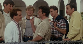 Movie still from “Porky's” (1981), directed by Bob Clark – A group of young men standing next to each other; Medium shot, Over the shoulder angle