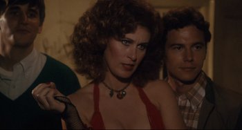 Movie still from “Porky's” (1981), directed by Bob Clark – A person wearing a red dress; Close Up shot, Over the shoulder angle