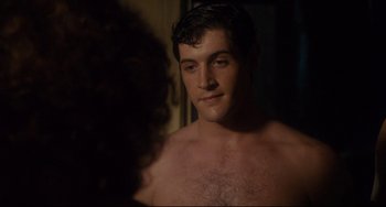 Movie still from “Porky's” (1981), directed by Bob Clark – A shirtless man looking at a woman in a mirror; Close Up shot, Over the shoulder angle