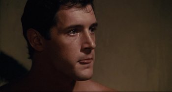 Movie still from “Porky's” (1981), directed by Bob Clark – A man's face in the dark; Close Up shot, Over the shoulder angle