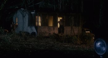 Movie still from “Porky's” (1981), directed by Bob Clark – A man standing in front of a window at night; Extreme Wide shot, Low angle