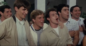 Movie still from “Porky's” (1981), directed by Bob Clark – A group of young men standing next to each other; Medium shot, Low angle