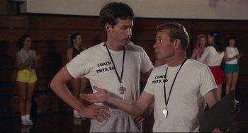 Movie still from “Porky's” (1981), directed by Bob Clark – A couple of men standing next to each other; Medium shot, Over the shoulder angle