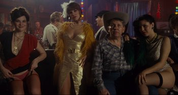 Movie still from “Porky's” (1981), directed by Bob Clark – A man and a woman dressed up for a party; Medium shot, Low angle