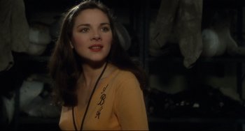 Movie still from “Porky's” (1981), directed by Bob Clark – A woman in a yellow shirt is looking at the camera; Close Up shot, Over the shoulder angle