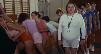 Movie still from “Porky's” (1981), directed by Bob Clark – A group of women in white shorts and bras; Medium shot, Over the shoulder angle