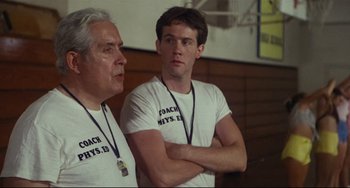 Movie still from “Porky's” (1981), directed by Bob Clark – Two men standing next to each other in front of a wall; Close Up shot, Low angle