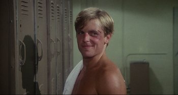 Movie still from “Porky's” (1981), directed by Bob Clark – A man with a towel around his neck and shoulders; Close Up shot, Low angle