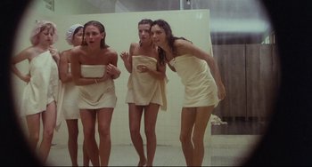 Movie still from “Porky's” (1981), directed by Bob Clark – A group of young women in towels in a bathroom; Wide shot, High angle