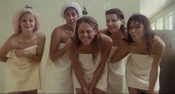 Movie still from “Porky's” (1981), directed by Bob Clark – A group of young women in towels posing for a picture; Medium shot, Low angle